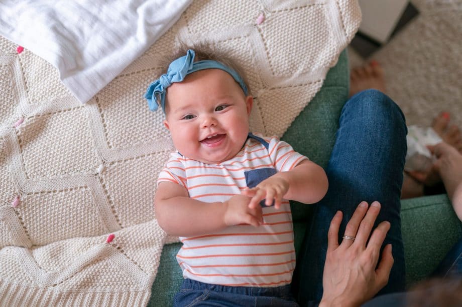 teething baby in stripes