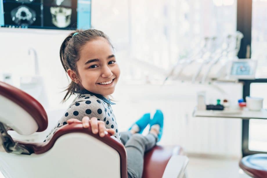 girl smiling in dental chair