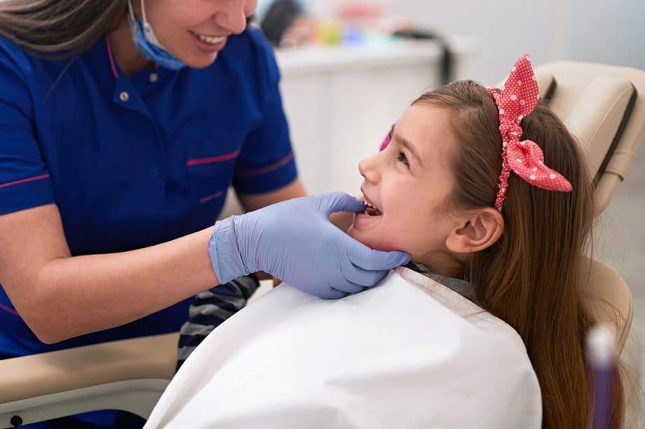 girl laughing in dental chair