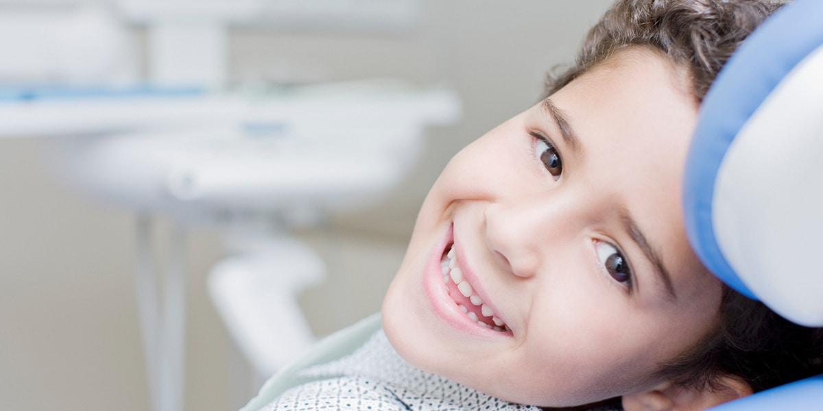 Child Smiling with dentist decorative photo