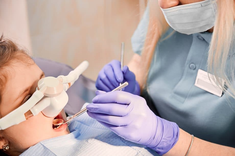 child in dental chair with sedation respirator